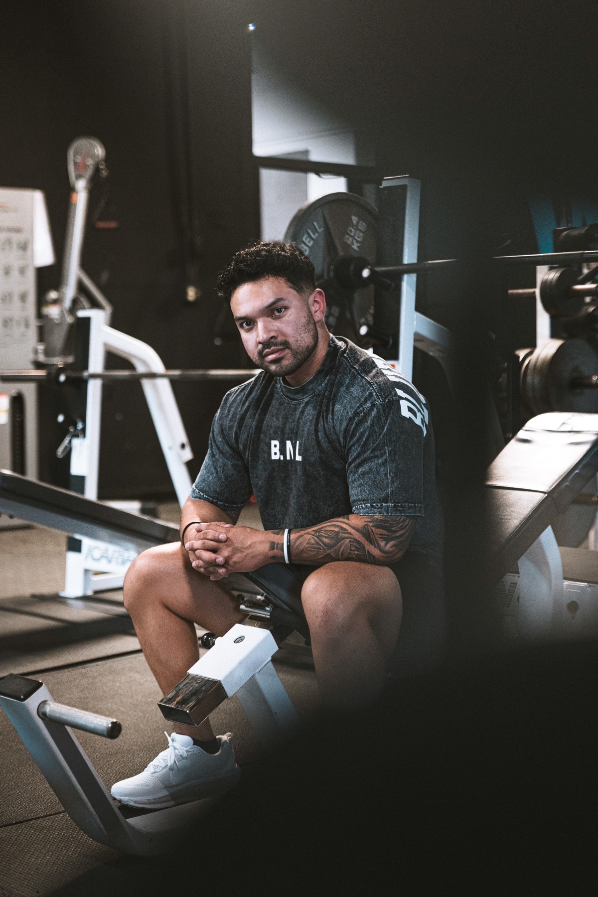 Elijah seated in the gym, looking directly at the camera.
